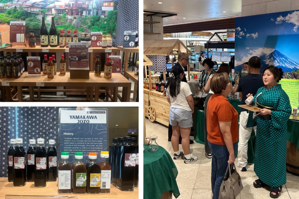 MITSUKOSHI BGCでの「東海の発酵食フェア」展示風景。山川醸造や九重味醂などのブースが並び、来場者がスタッフと会話を交わしている。